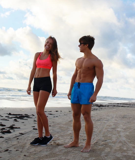 Couple wearing custom made fitness shorts by farnix sports