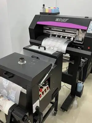 Machine doing direct to film method on shirt