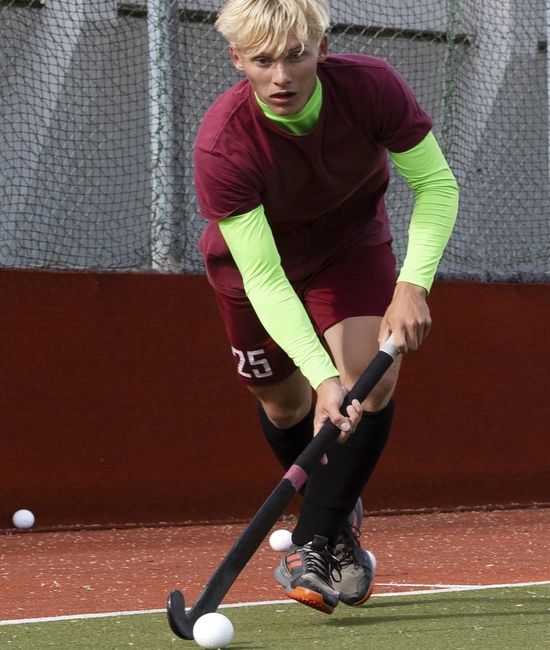 Men wearing custom made mehroon hockey uniform