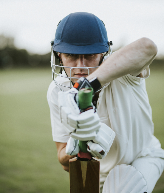 Men wearing cricket uniform manufactured by farnix sports