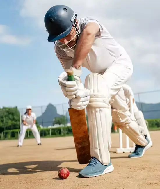 Player wearing custom made white cricket uniform