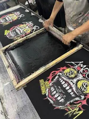 Worker doing screen printing