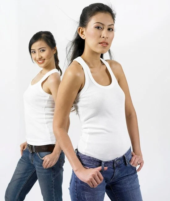 Two friends wearing custom made white tank tops by farnix sports