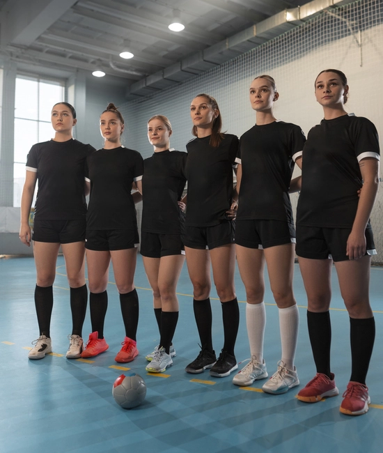 Women soccer team wearing custom made black soccer uniform